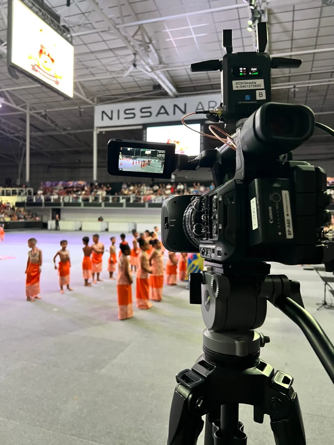Arena performance filming with professional camera
